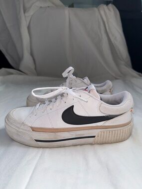 Nike White Sneakers with Black Swoosh and Beige Trim